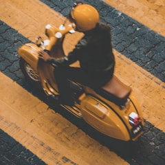 Person on a Vespa vehicle